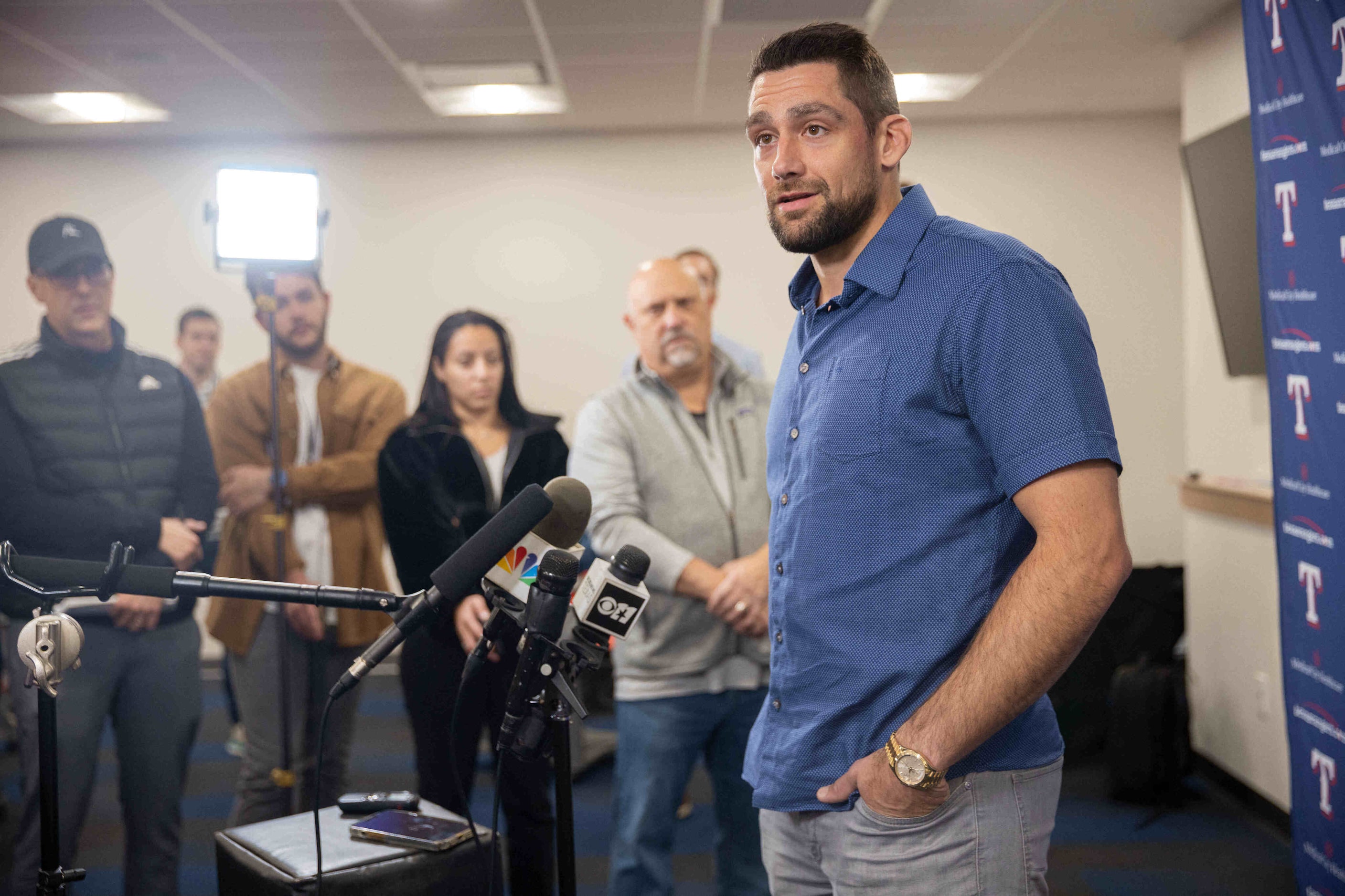 Texas Rangers starting pitcher Nathan Eovaldi speaks during a press conference announcing...