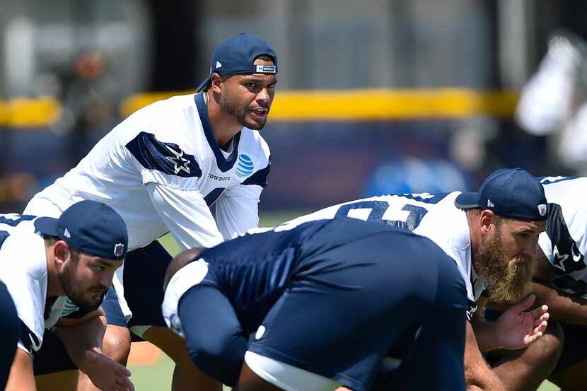 Dallas Cowboys quarterback Dak Prescott runs the offense during NFL football training camp...