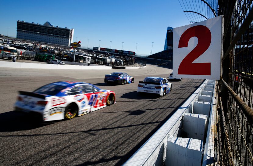 Sprint Cup Series driver AJ Allmendinger (47) passes by a turn indicator on the front...