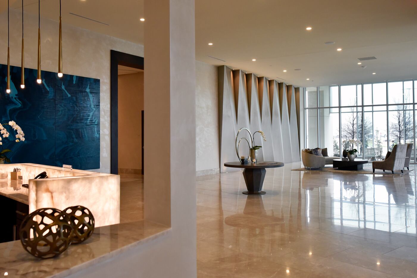 The lobby area and front desk inside the Twelve Cowboys Way luxury residential tower at the...