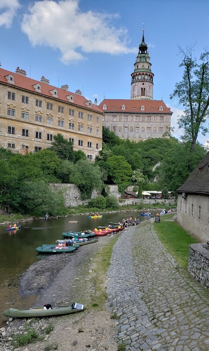 Rafts, canoes and kayaks fill the Vltava River as it meanders through Český Krumlov.