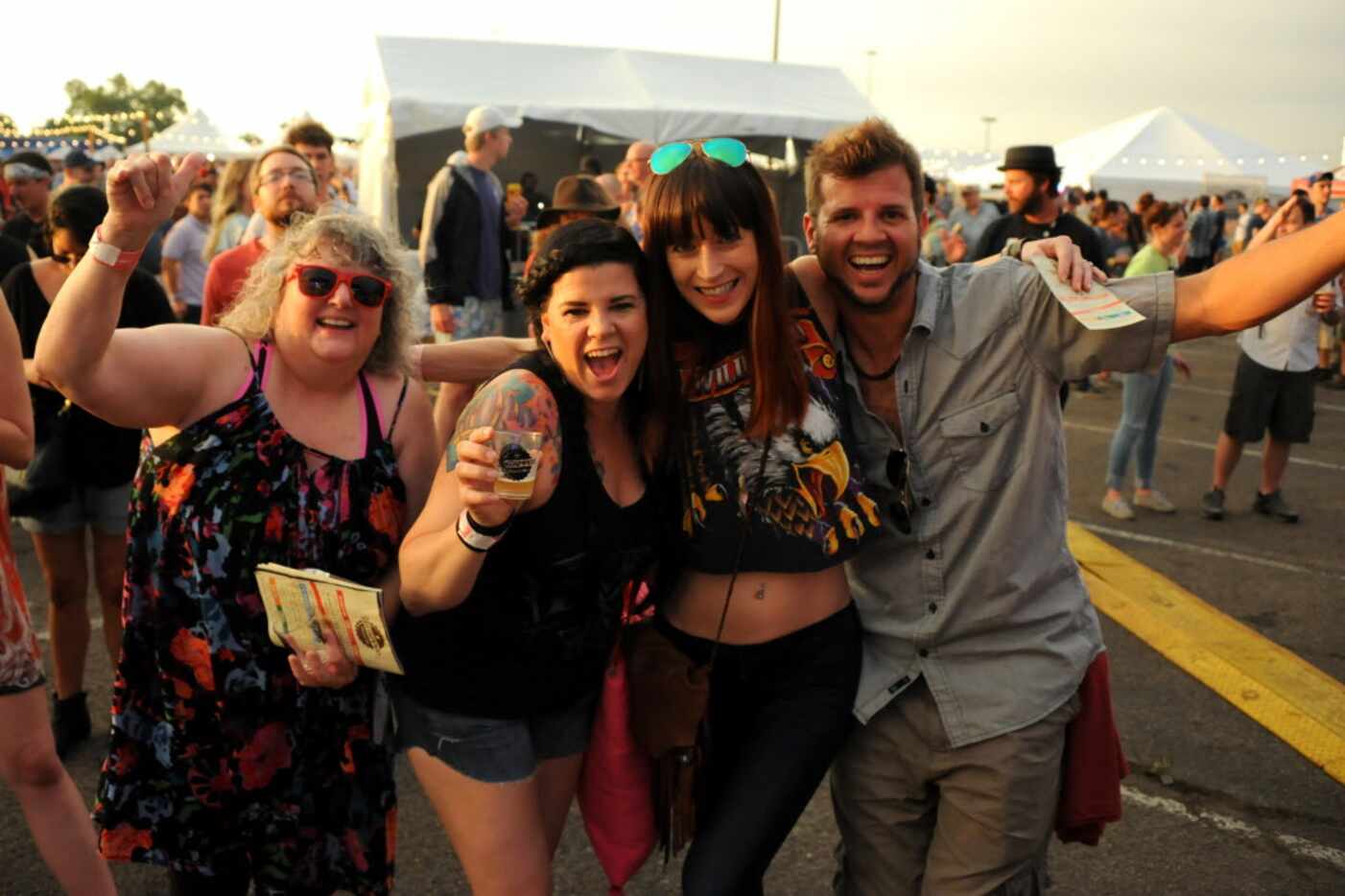 Friends drink craft beer at Untapped Festival in Fort Worth, TX on May 9, 2015.