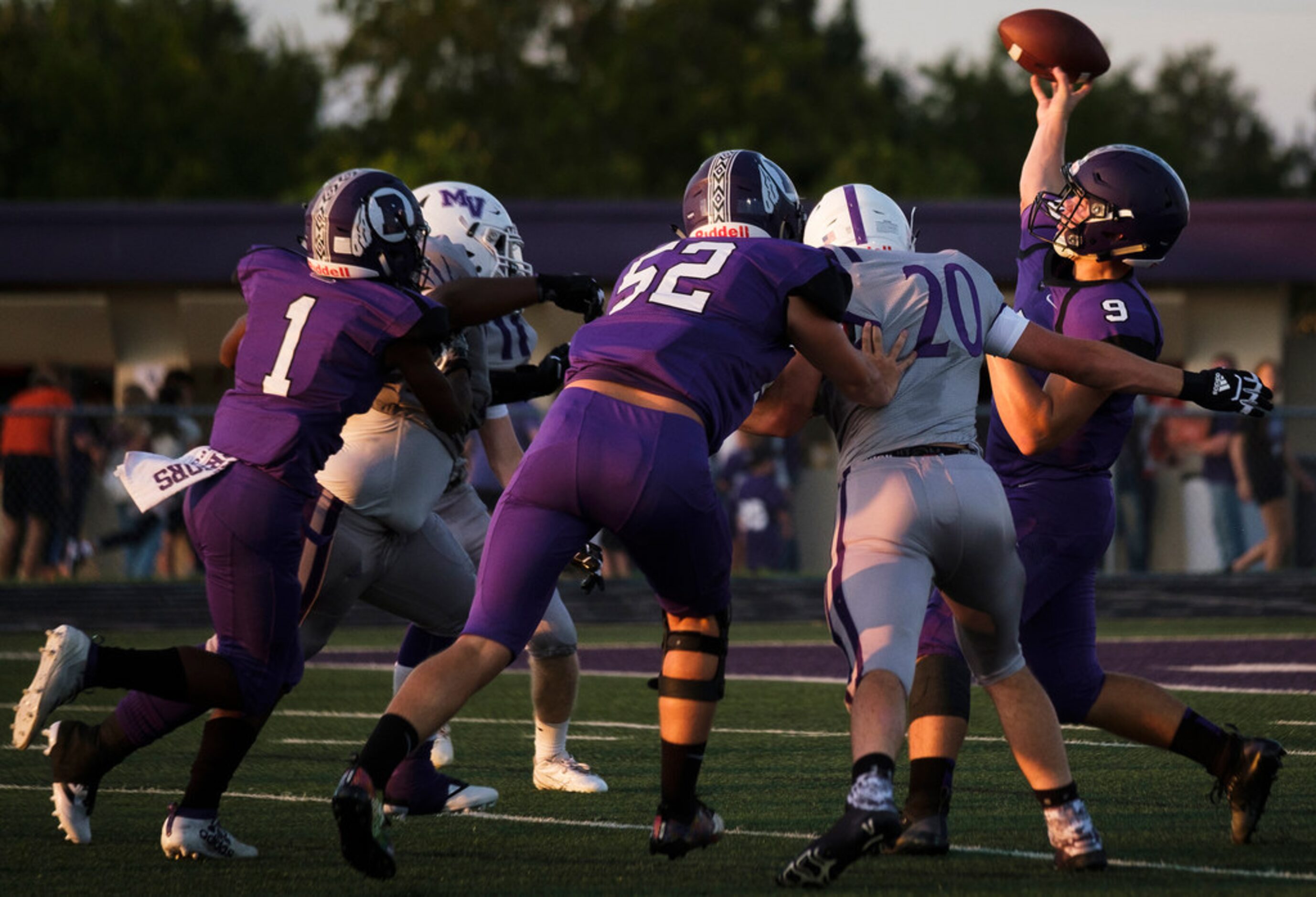 Bonham quarterback  Brant Stuber (9) throws a pass under pressure from the Mount Vernon...