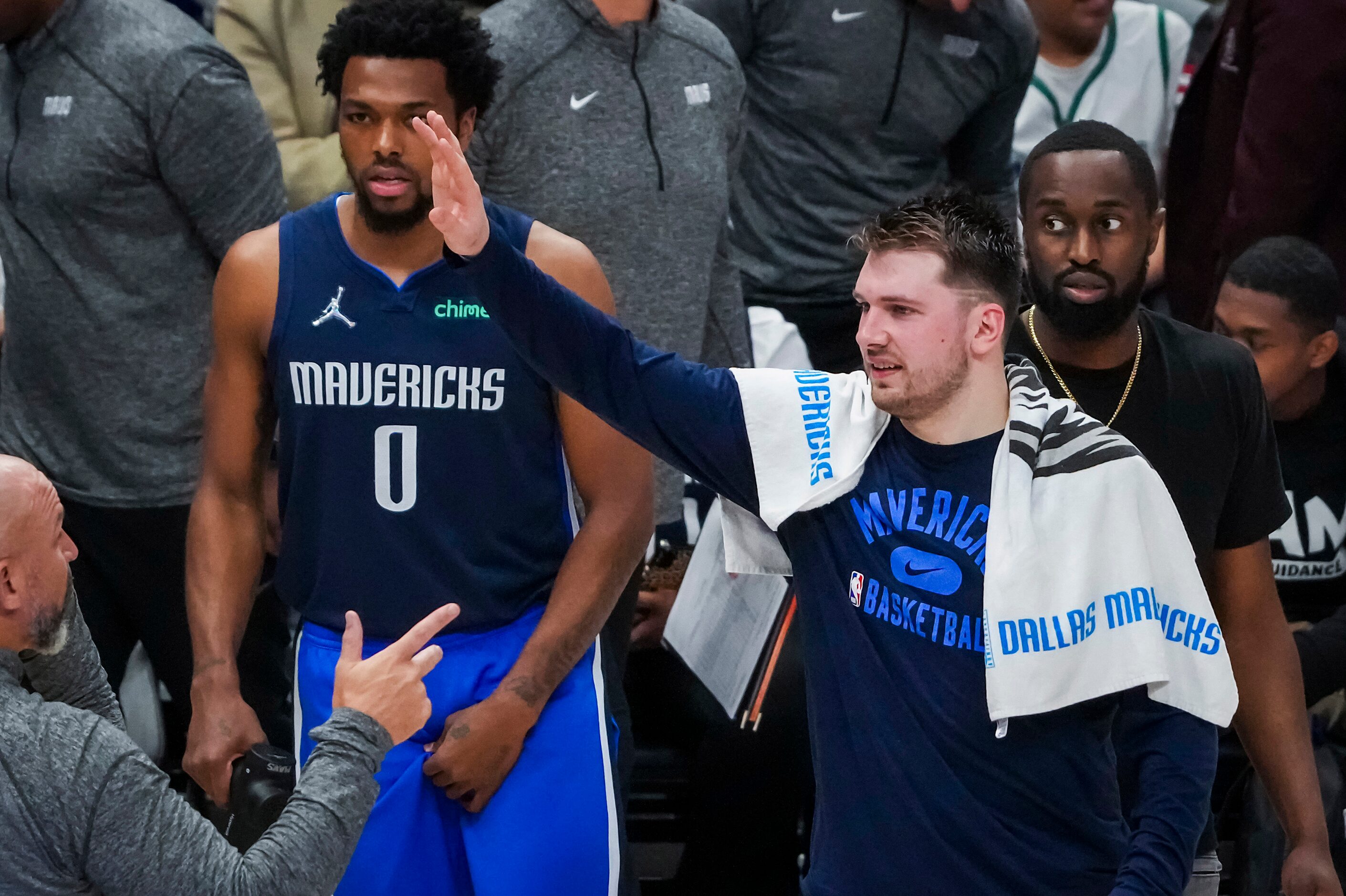 Dallas Mavericks guard Luka Doncic celebrates on the bench during the fourth quarter in Game...