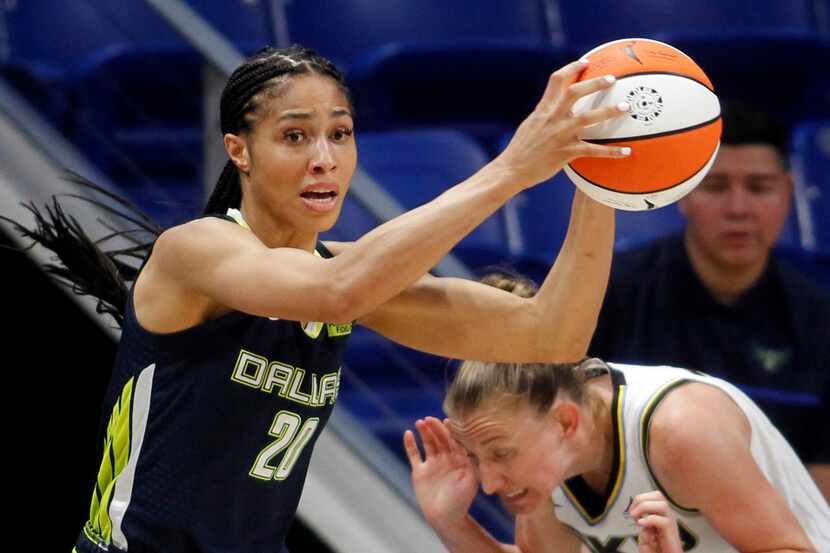 Dallas Wings forward Isabelle Harrison (20) pulls down a rebound as Chicago Sky guard...