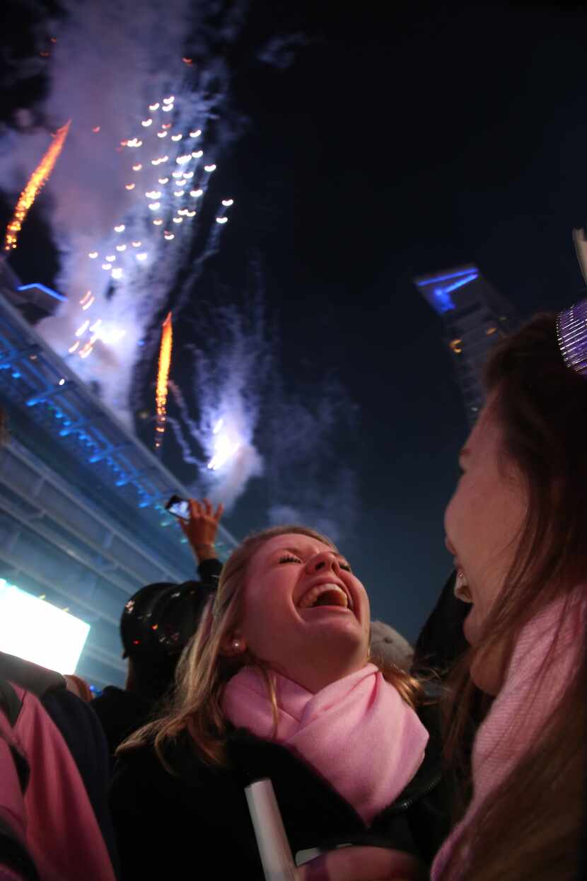AND ON NEW YEARS EVE ... Sarah Cooper (left) and Elizabeth Cooper laugh as they watch...