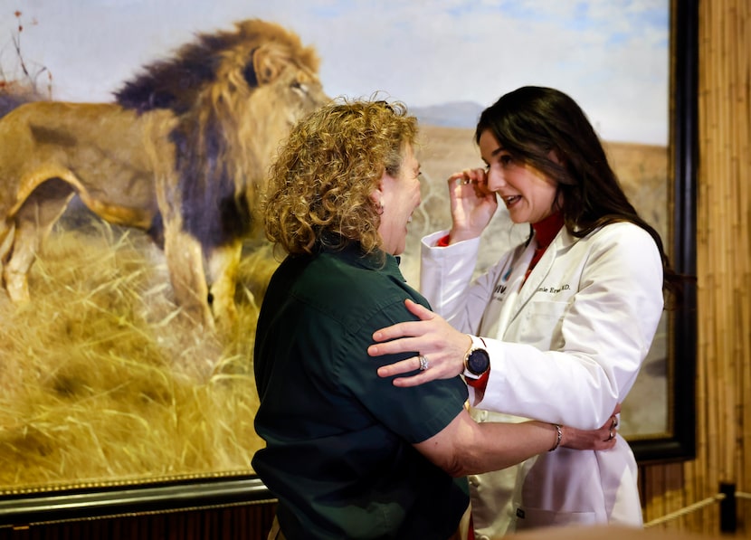 Dr. Jamie Walker (right) is overcome with emotion after hearing the announcement from...