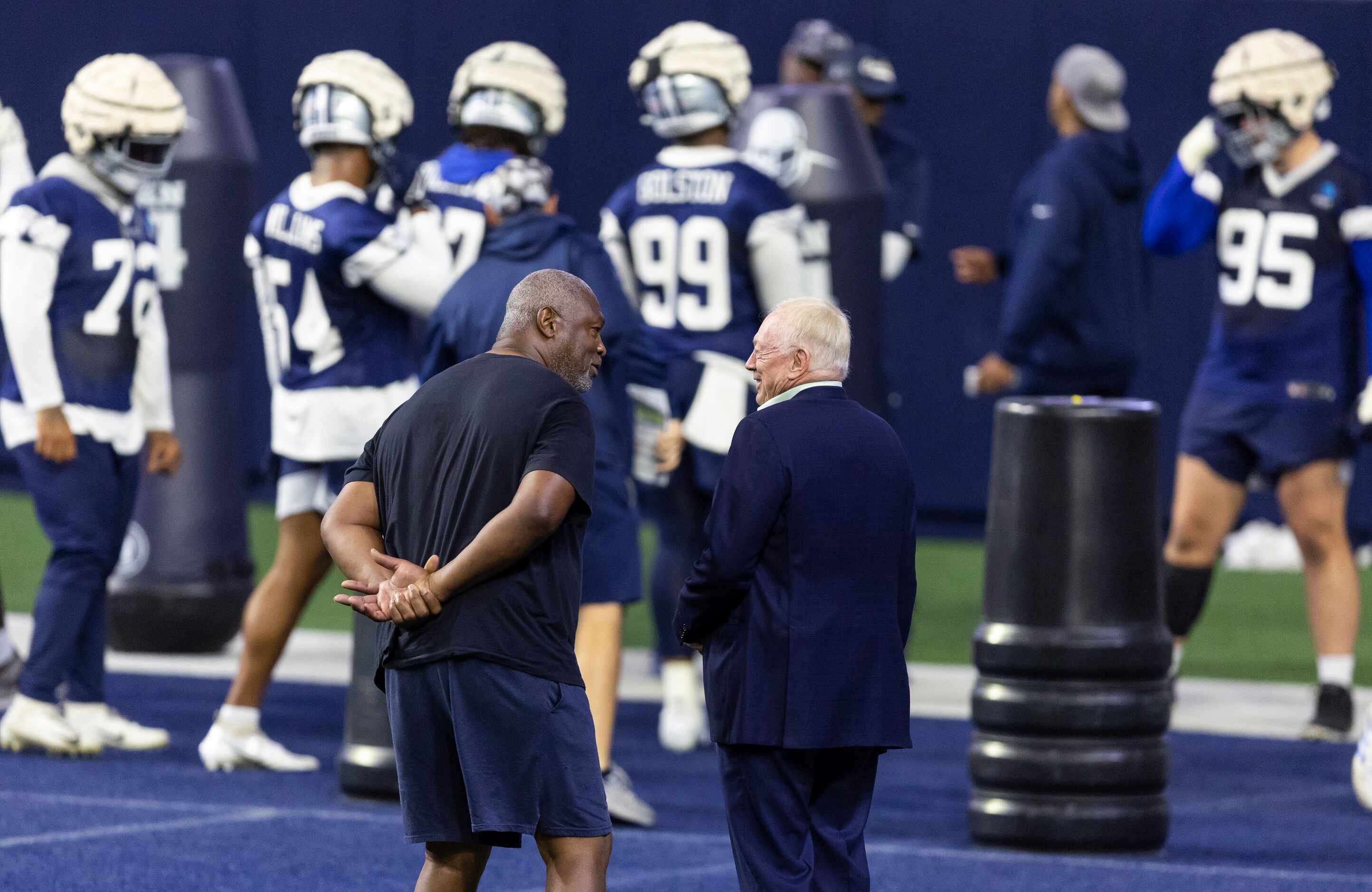 Former Dallas Cowboys Charles Haley, left, and owner Jerry Jones, right, are seen during a...