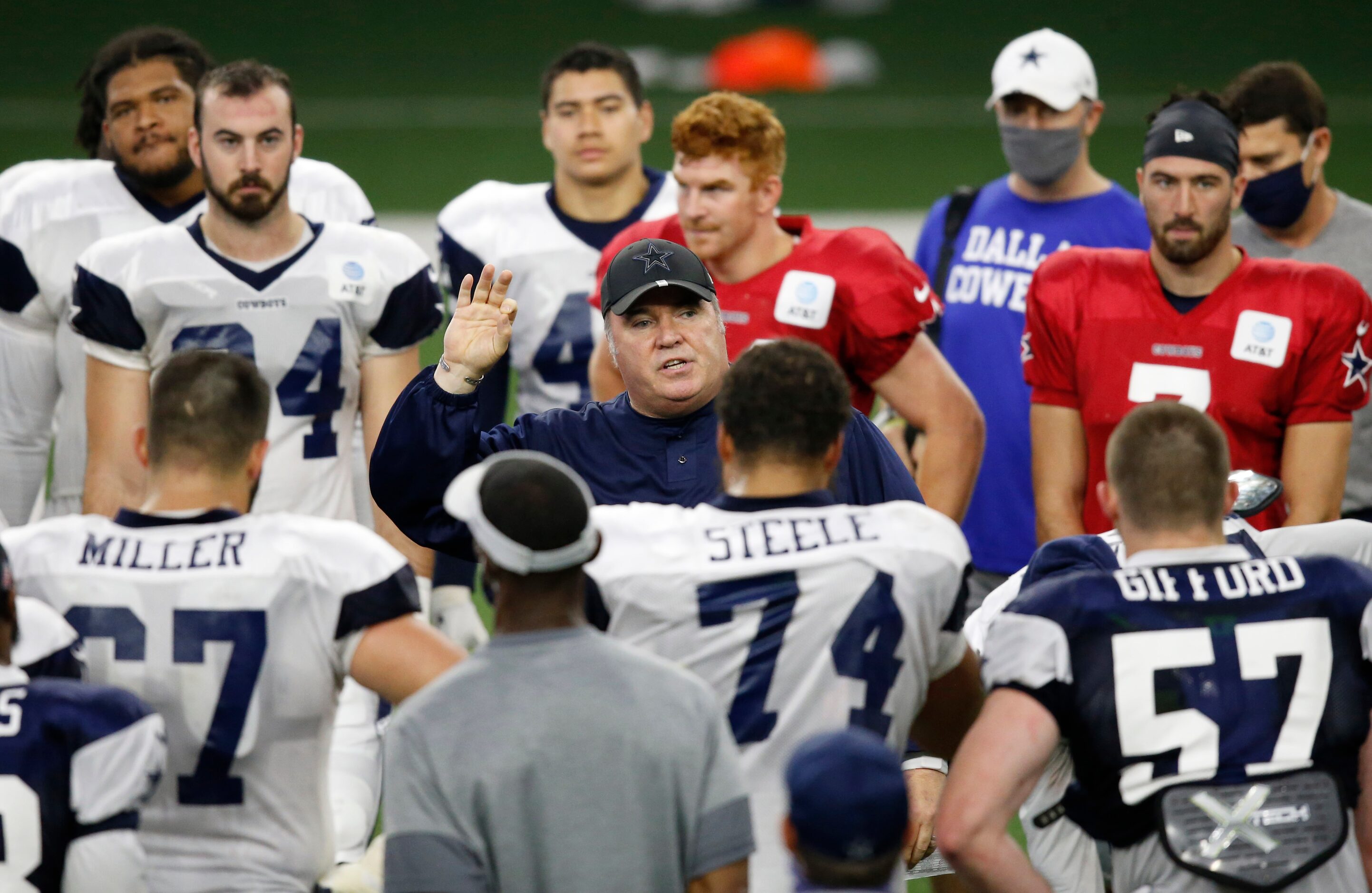 Dallas Cowboys head coach Mike McCarthy talks to the team after practice during training...