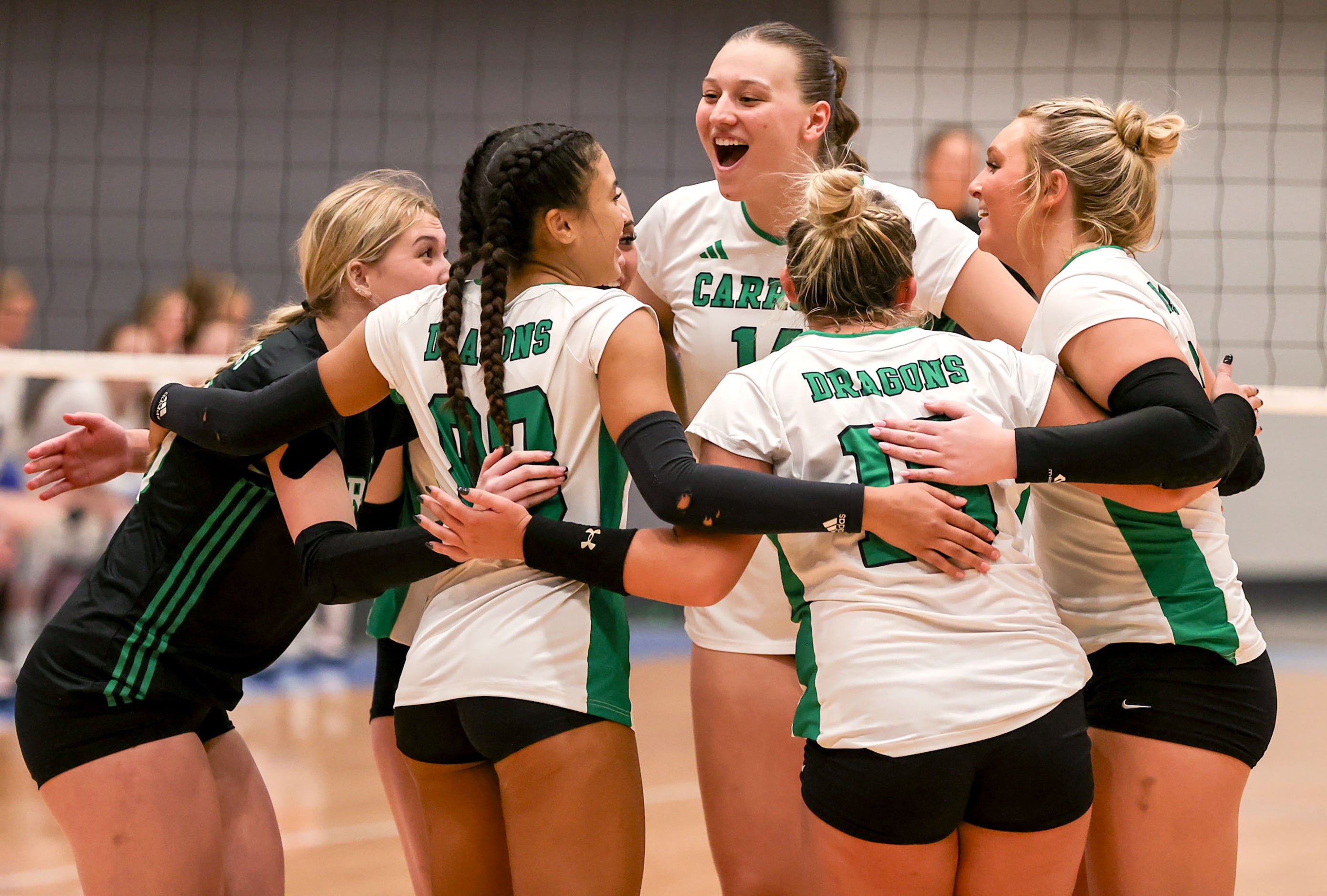 The Southlake Carroll Lady Dragons celebrate a point against Hebron during a Class 6A...