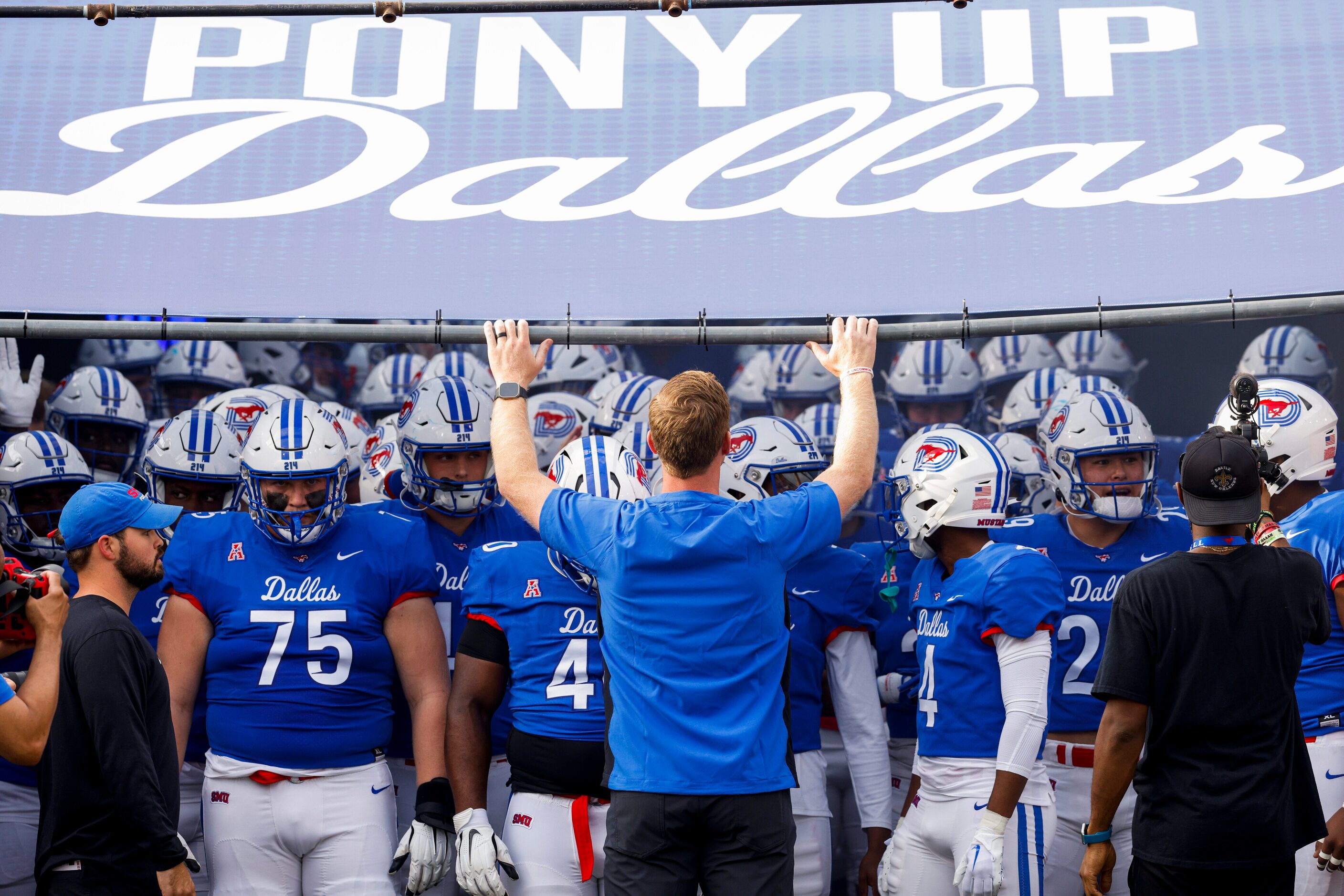 SMU head coach Rhett Lashlee watches over his team before they take the field for an NCAA...