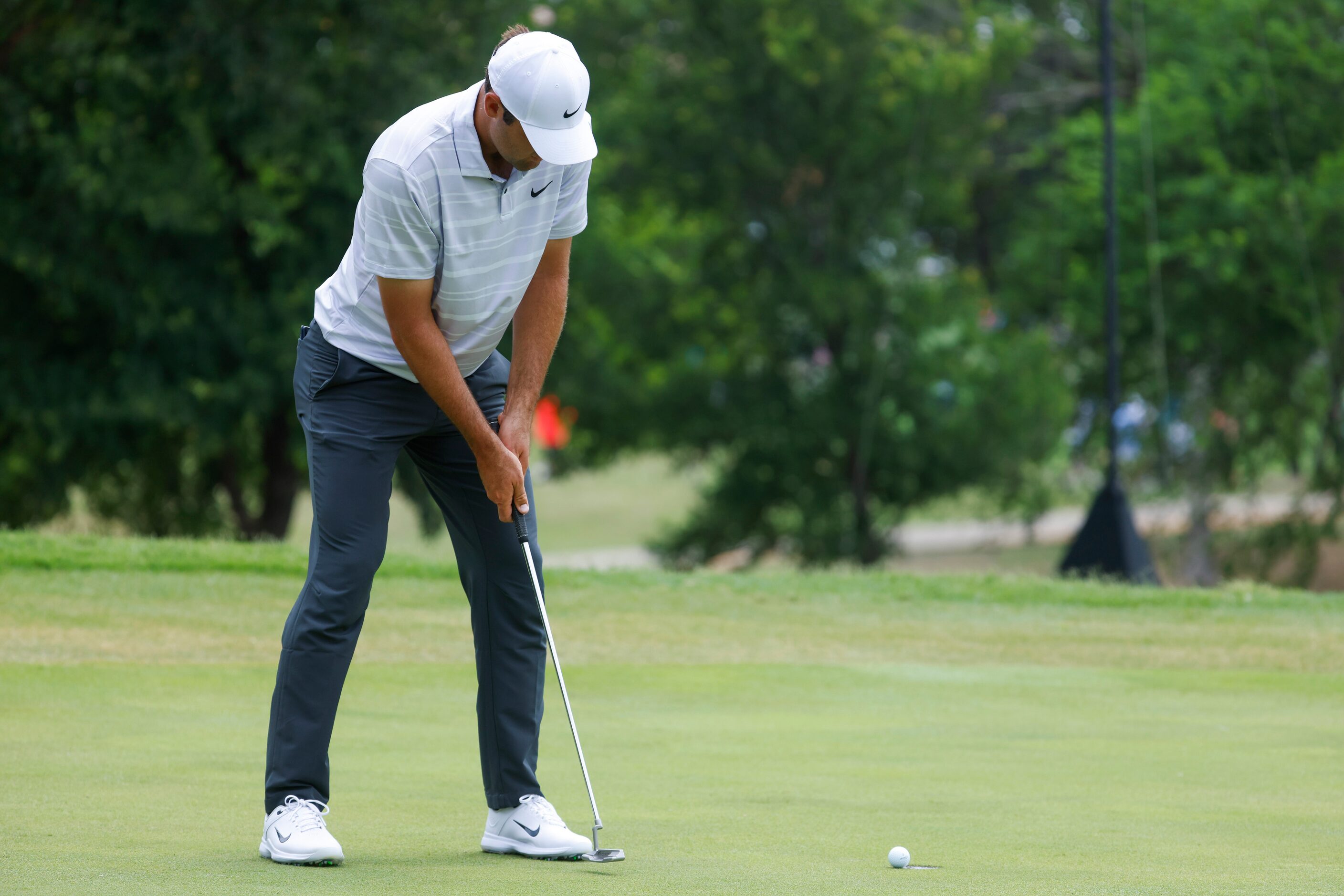 Scottie Scheffler putts on the eighth hole during the second round of the AT&T Byron Nelson...