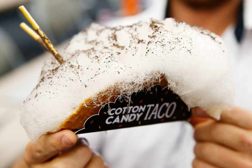 The cotton candy taco is a graham cracker waffle cone stuffed with chocolate, toasted...