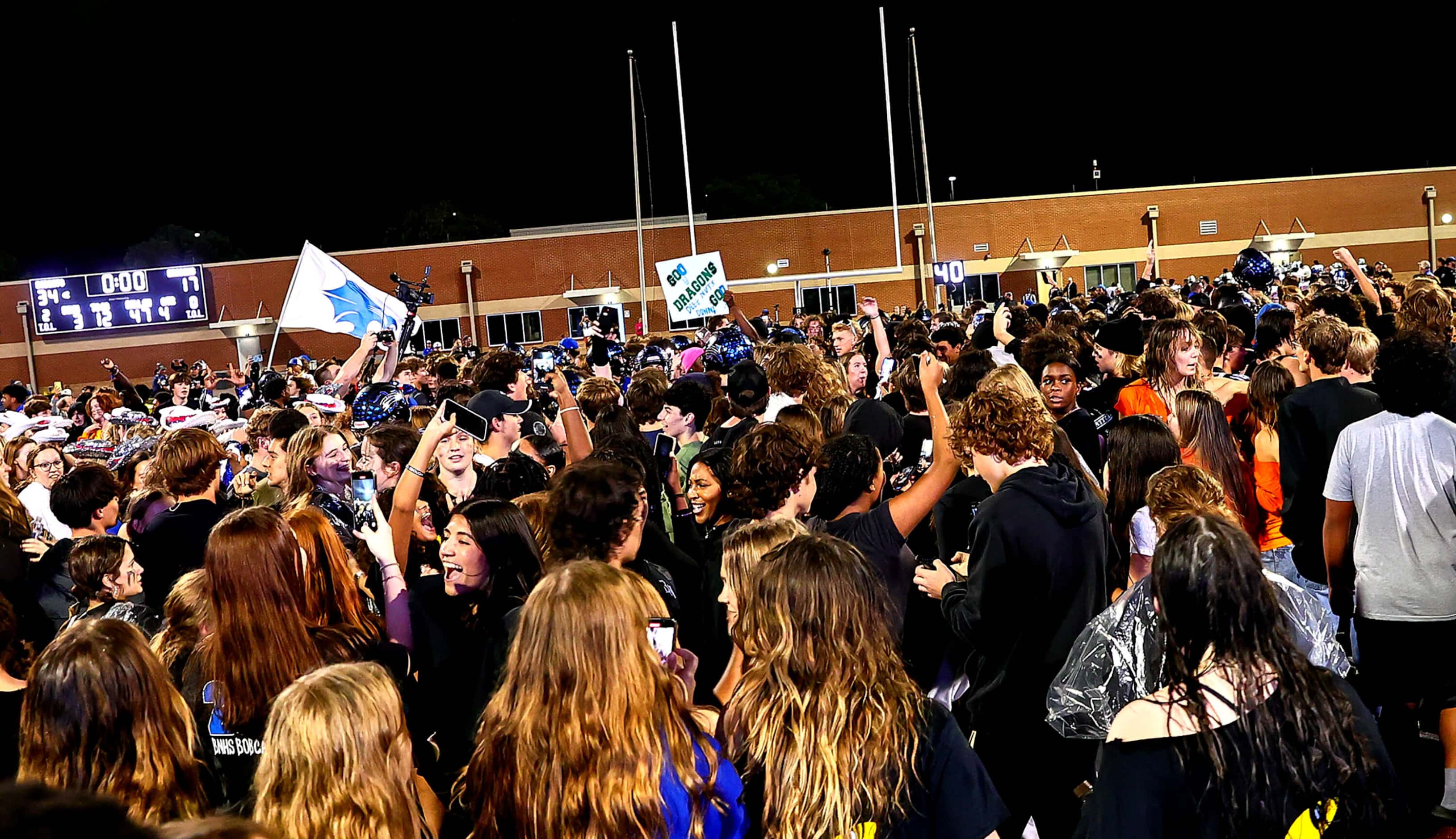 The Byron Nelson student body pour on to the field after a 34-17 victory over Southlake...