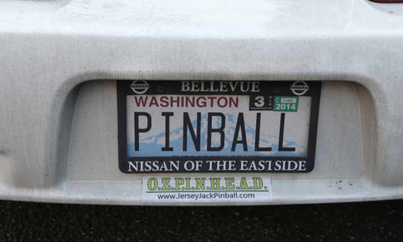 In this Dec. 16, 2013 photo, a custom "PINBALL" vanity license plate is shown on a car owned...