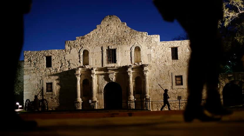 Dan Phillips, a member of the San Antonio Living History Association, patrols the Alamo...
