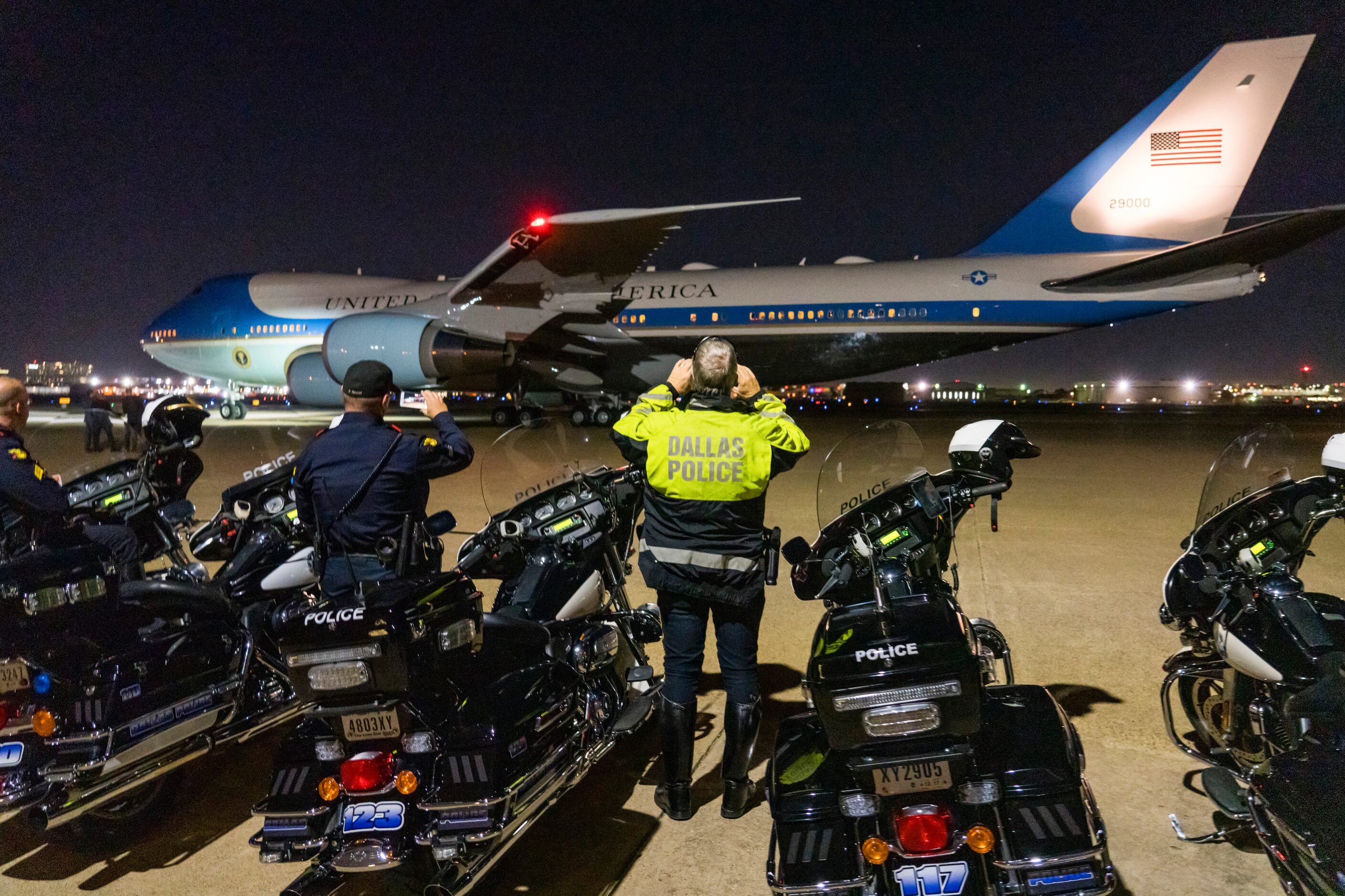 Dallas Police take photos of Air Force One as it departs Love Field after President Donald...