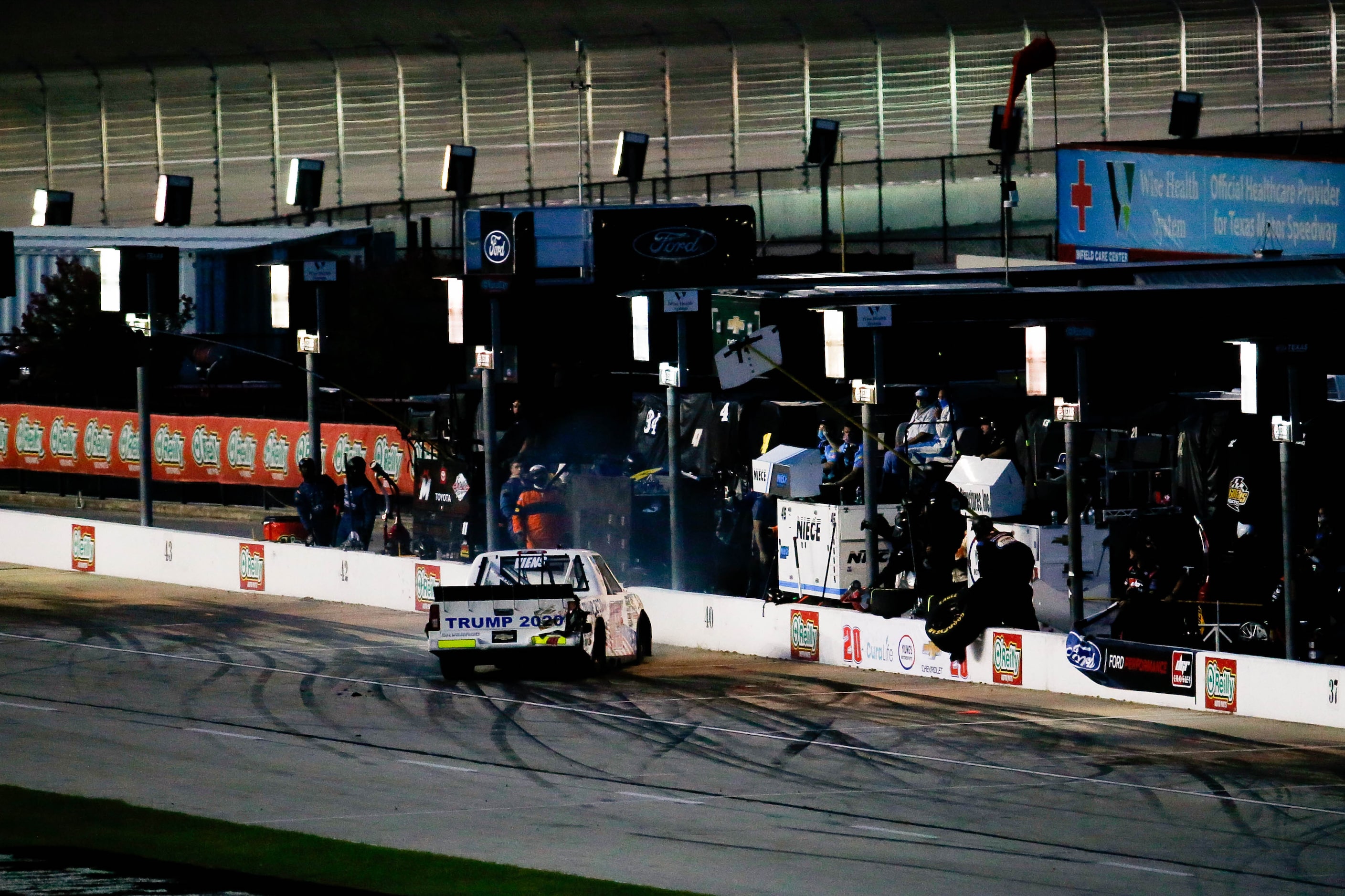 Tim Viens (No. 49) narrowly hits the wall as he slides into pit road during the Vankor 350...