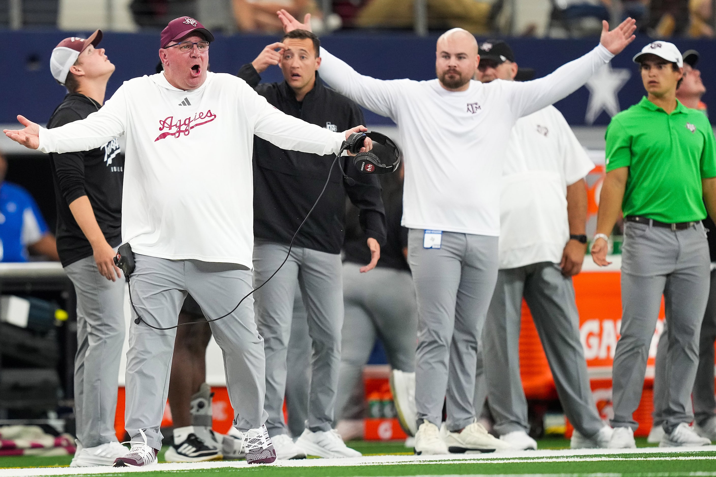 Texas A&M head coach Mike Elko reacts to a call during the first half of an NCAA football...