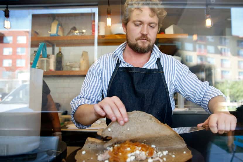 Owner Julien Eelsen sprinkles folds a smoked pork crepe at Whisk Crepes Cafe.
