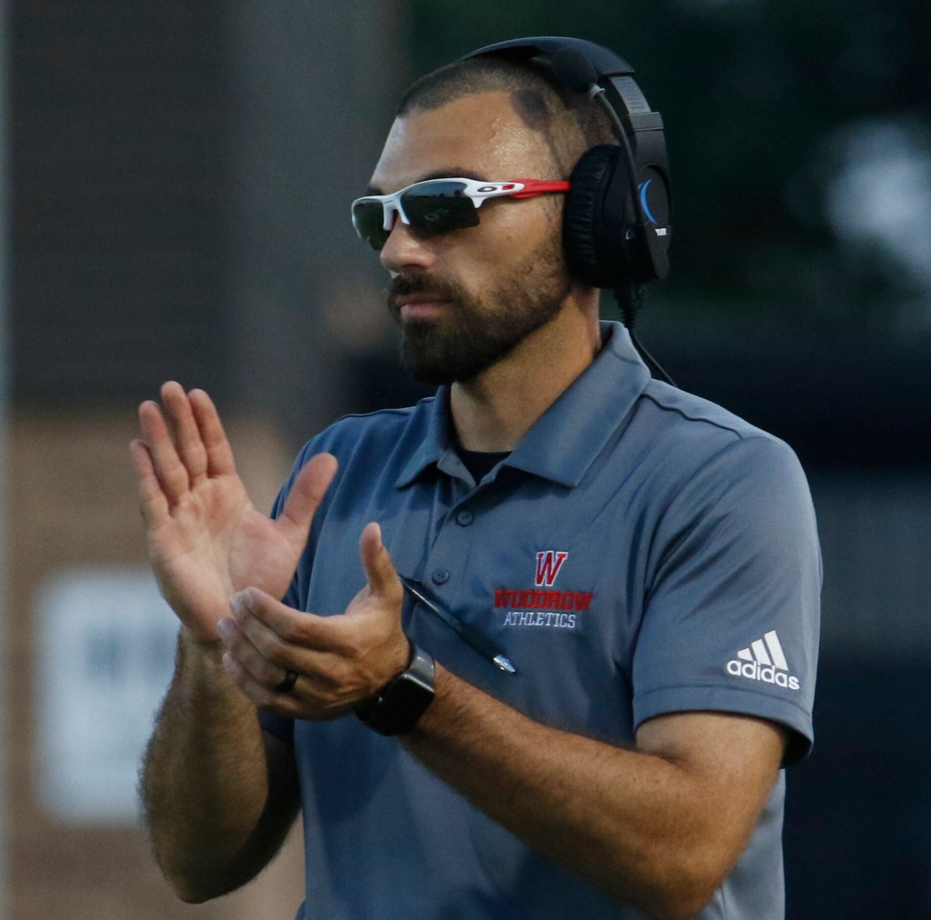 Dallas Woodrow Wilson head coach Tony Benedetto applauds a touchdown during first half...