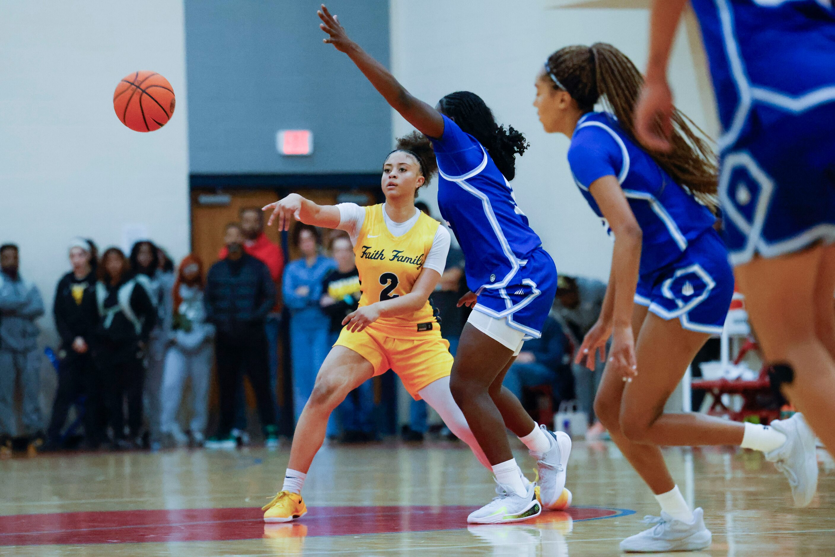 Oak Cliff Faith Family Academy’s Gianna Jordan (2) passes the ball against IMG Academy...