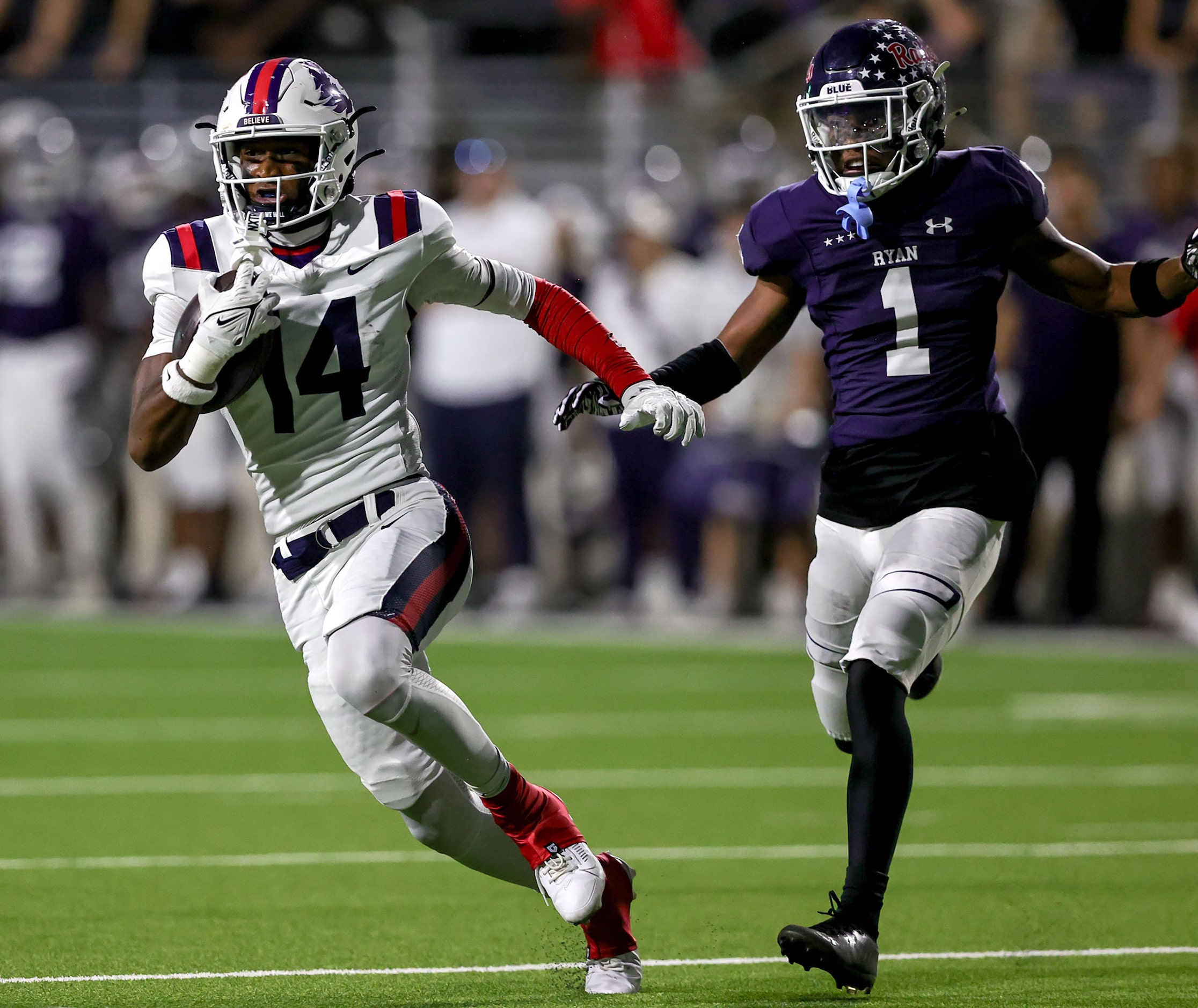 Richland wide receiver Xavier Johnson (14) gets past Denton Ryan defensive back Trae...