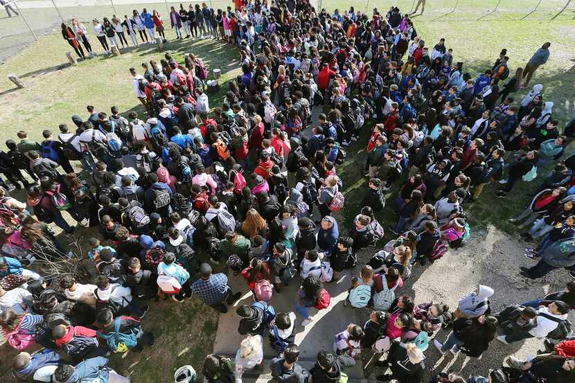 Hundreds of students from Tennyson Middle school gather at an outdoor classroom during the...