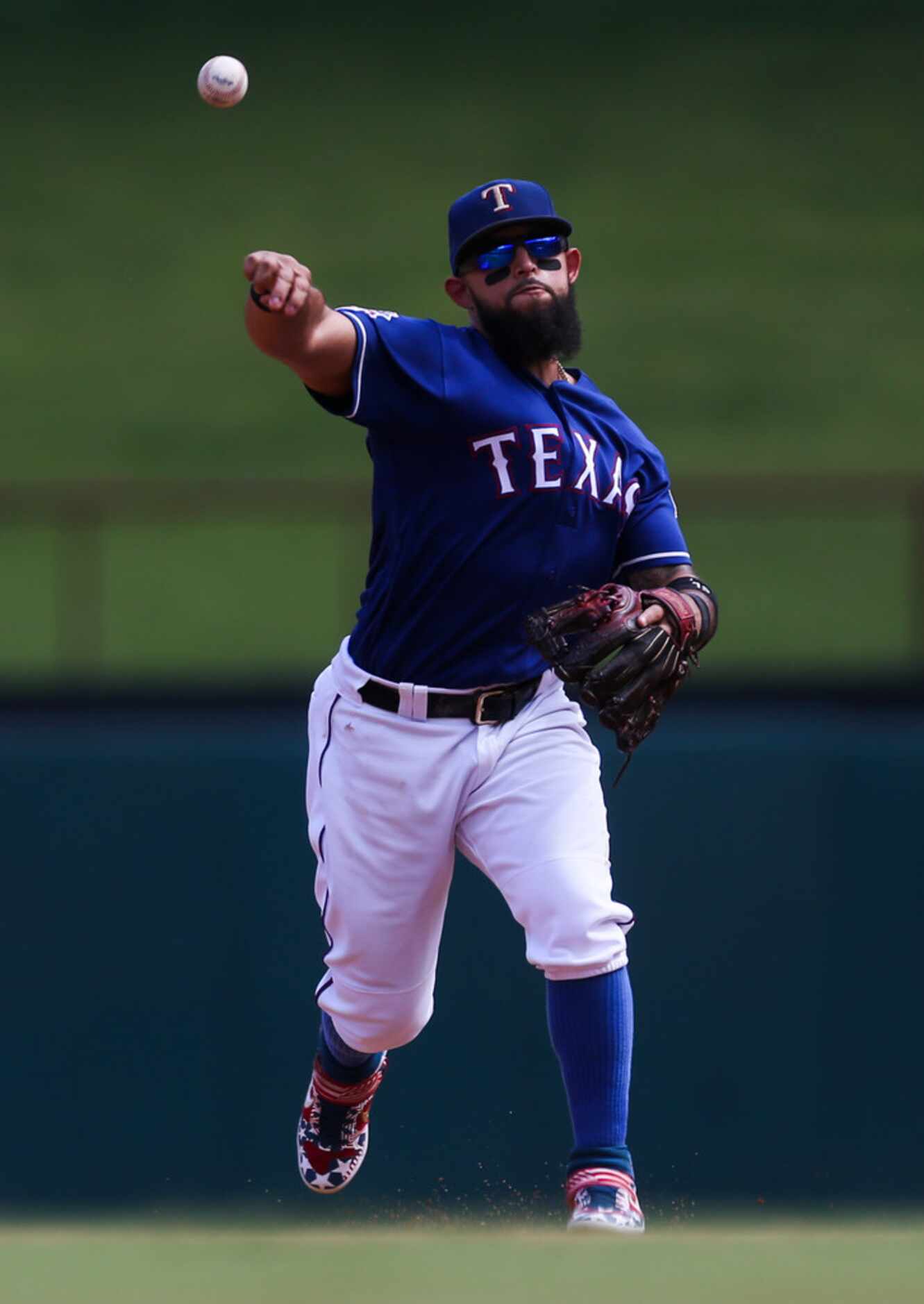 Texas Rangers shortstop Elvis Andrus (1) throws to first during a MLB game between Texas...