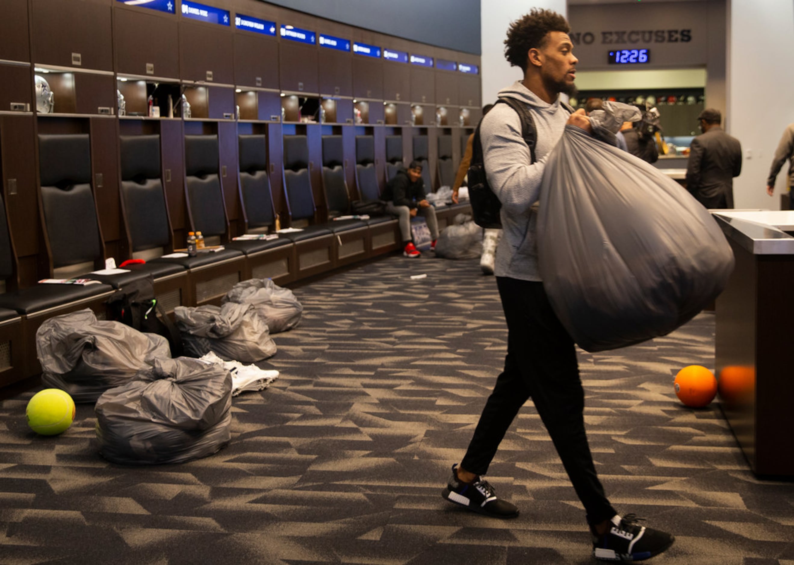 Dallas Cowboys cornerback C.J. Goodwin walks out after cleaning out his locker at The Star...