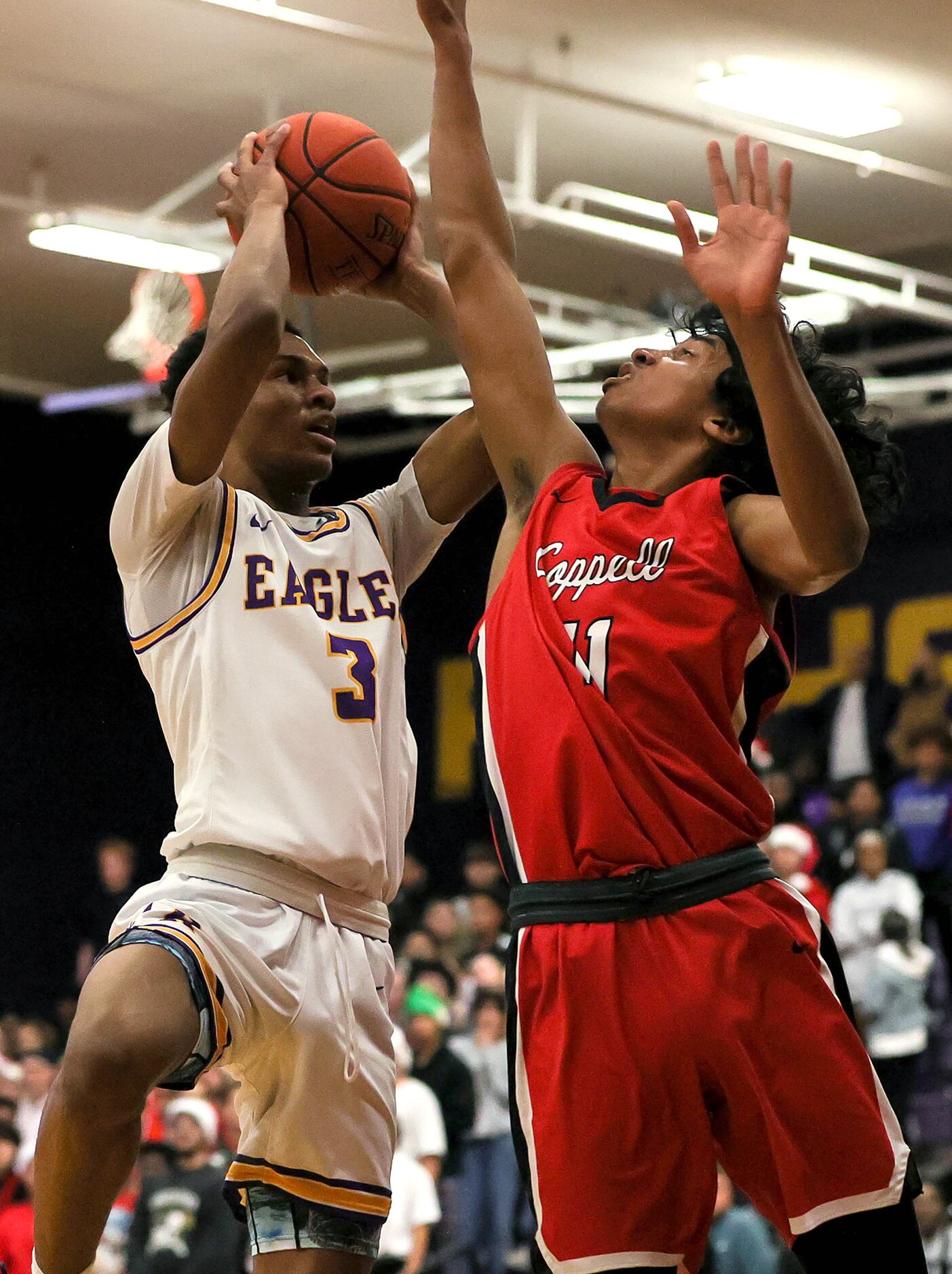 Richardson guard Rylan Griffen (3) goes to the basket against Coppell guard Ryan Agarwal (r)...