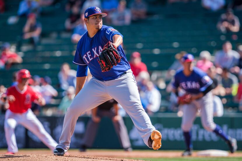 Texas Rangers pitcher Ariel Jurado pitches during the second inning of a spring training...