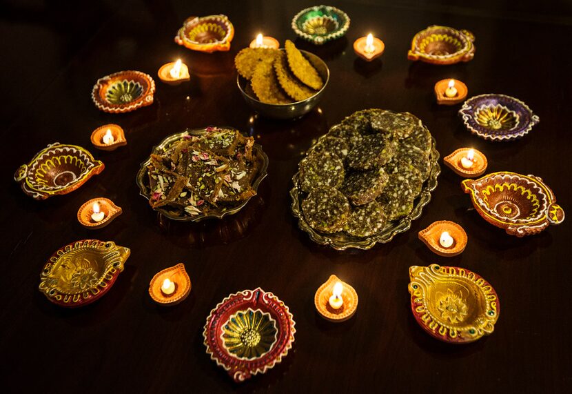 Clockwise from lower left: besan barfi, a chickpea fudge; mathri spice Indian crackers; and...