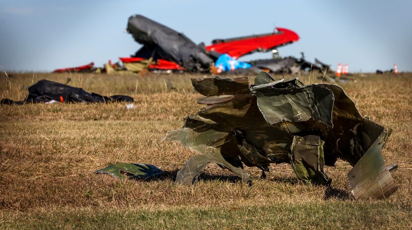 Debris lays across the open field at Dallas Executive Airport on Sunday, Nov. 13, 2022, in...