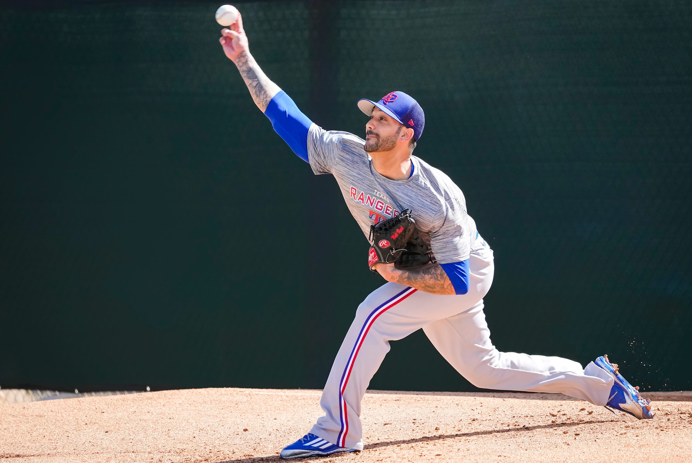 Texas Rangers pitcher Matt Bush throws a bullpen session during the team’s first minor...