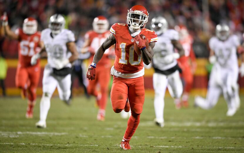 Kansas City Chiefs wide receiver Tyreek Hill (10) returns a punt 78 yards for a touchdown in...