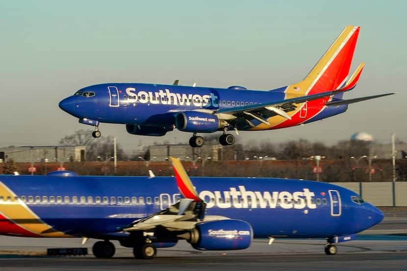 FILE - Southwest Airlines plane prepares to land at Midway International Airport, Feb. 12,...