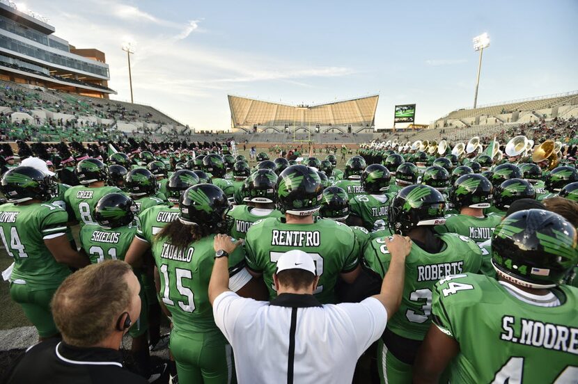 The North Texas Mean Green take the field. David Minton/DRC