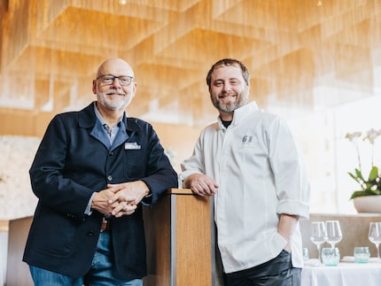 Chef and owner stand in restaurant