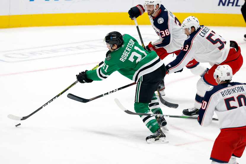 Dallas Stars left wing Jason Robertson (21) shoots and scores a third period goal against...