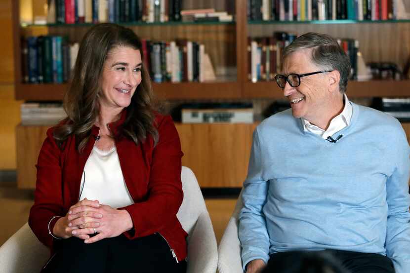 Bill and Melinda Gates look toward each other and smile while being interviewed in Kirkland,...