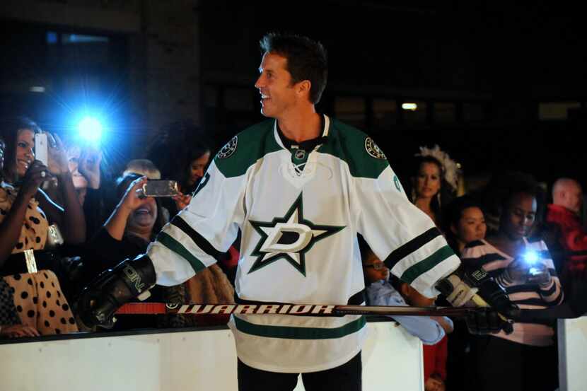 Dallas Stars alumni Mike Modano skates on the ice at the grand opening of Sparkle located in...