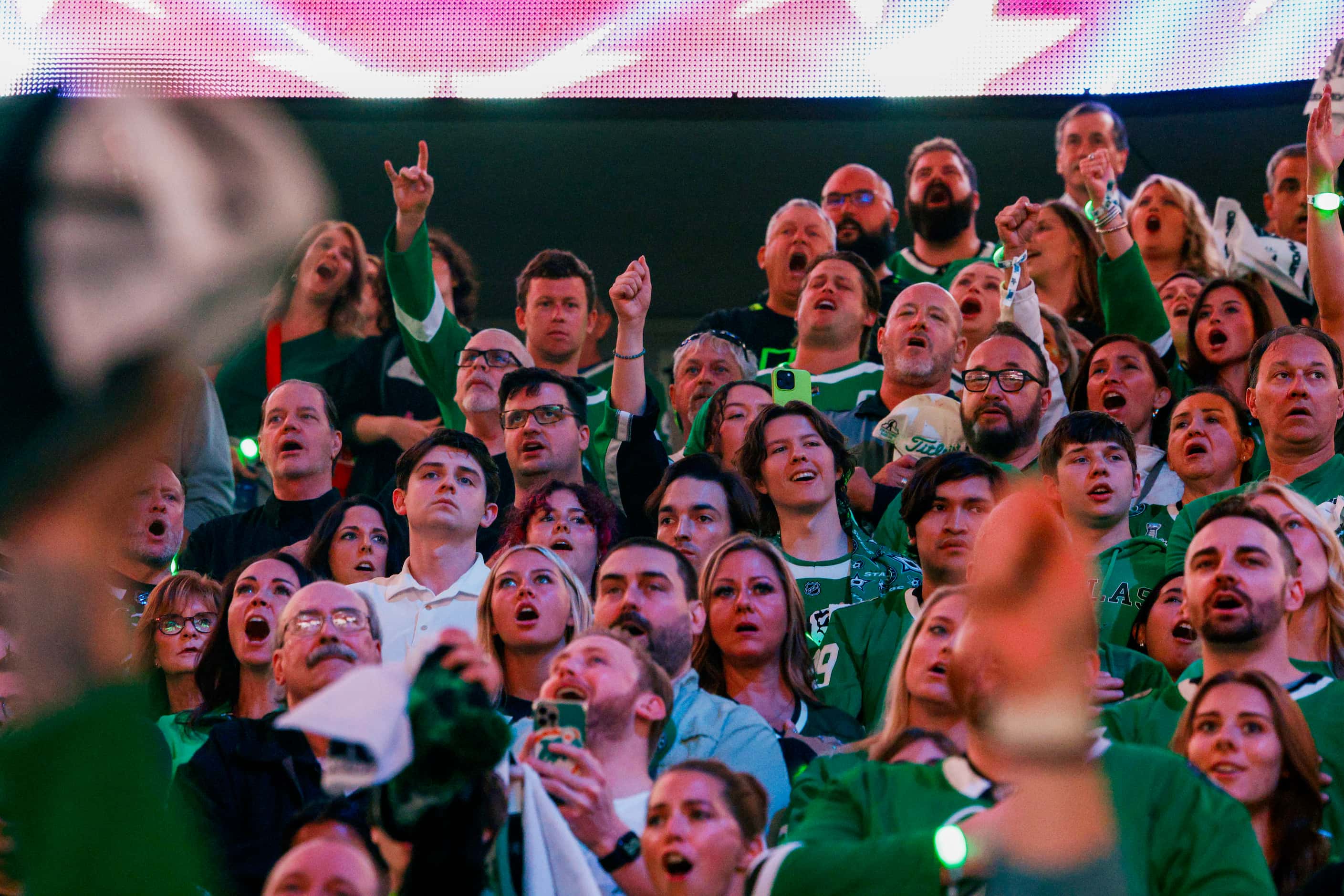 Dallas Stars fans yell “Stars” during the national anthem before Game 2 of the NHL hockey...