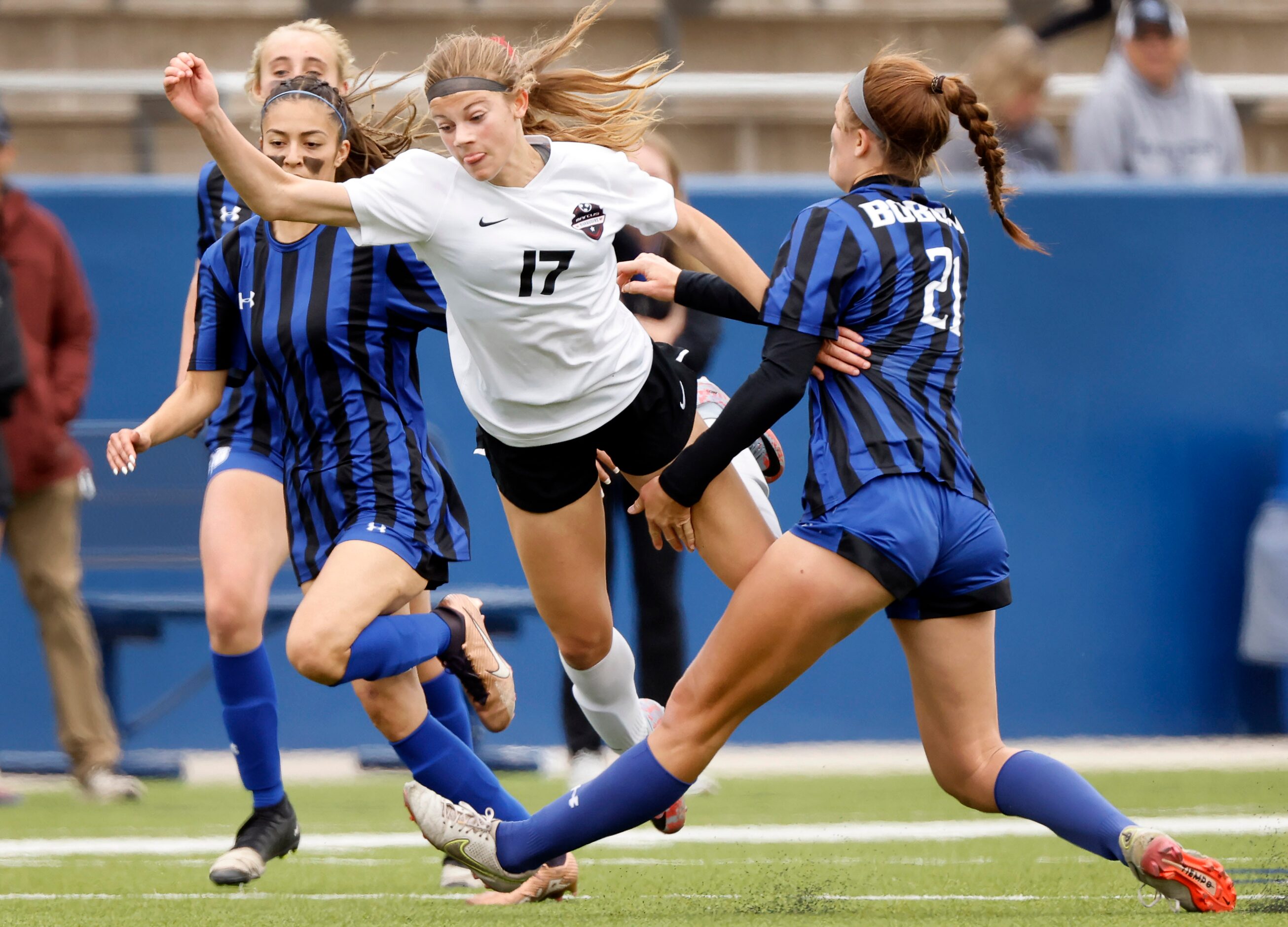 Flower Mound Marcus forward Madi Patterson (17) is sent flying after being tripped by Trophy...