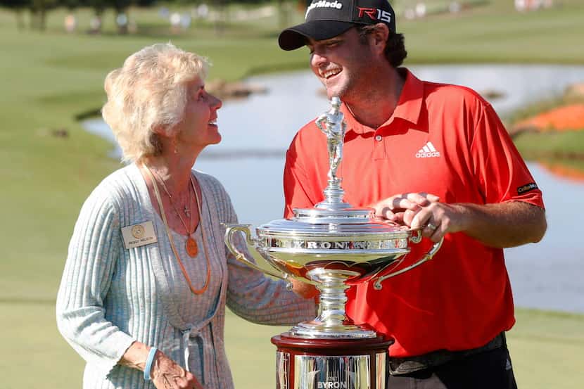 Steven Bowditch talks with Peggy Nelson during the trophy presentation after winning the...