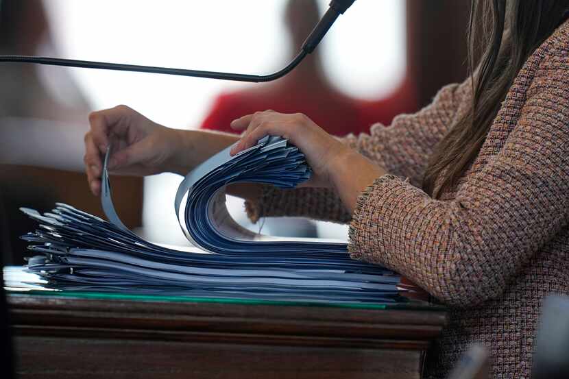 A stack of signed bills is sorted in the House chamber at the Texas Capitol in Austin on...