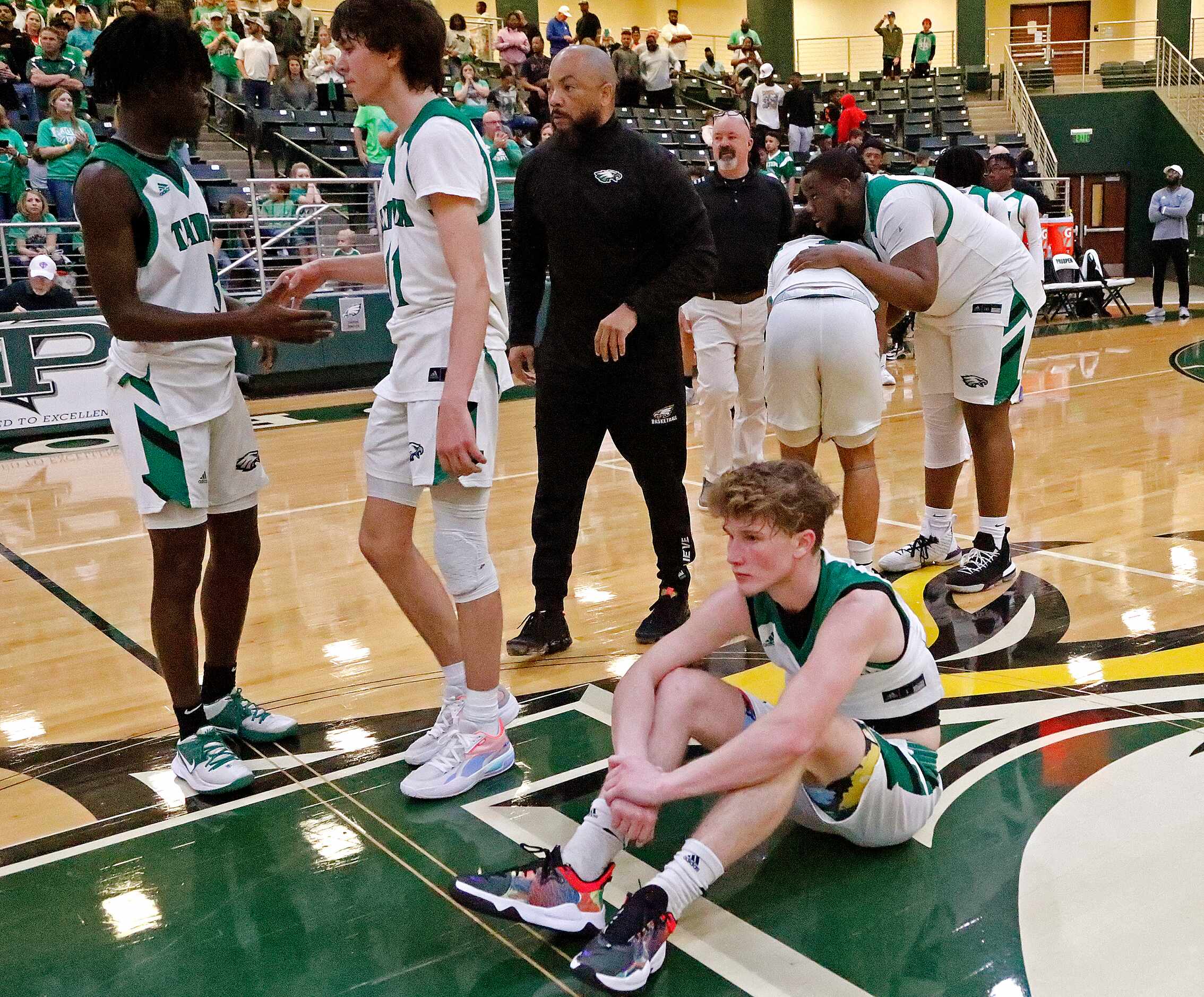 Tatum guard Ty Bridges (10) sits in disbelief that the season has ended after the 3A Region...