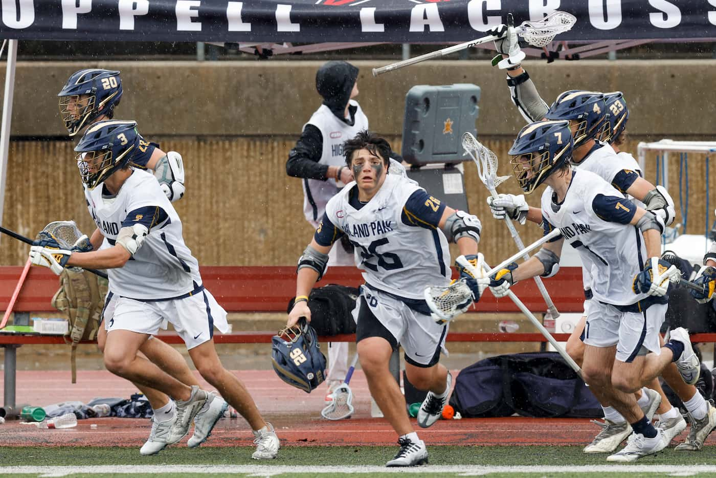 Highland Park players rush the field after winning the Class AA 2023 Texas High School...