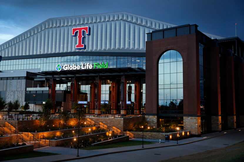 The exterior of Globe Life Field in Arlington in the twilight.