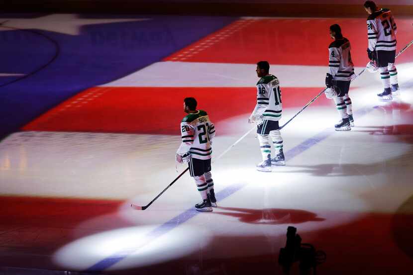 Dallas Stars Ryan Suter (20), Joe Pavelski (16), Miro Heiskanen (4) and Roope Hintz (24)...